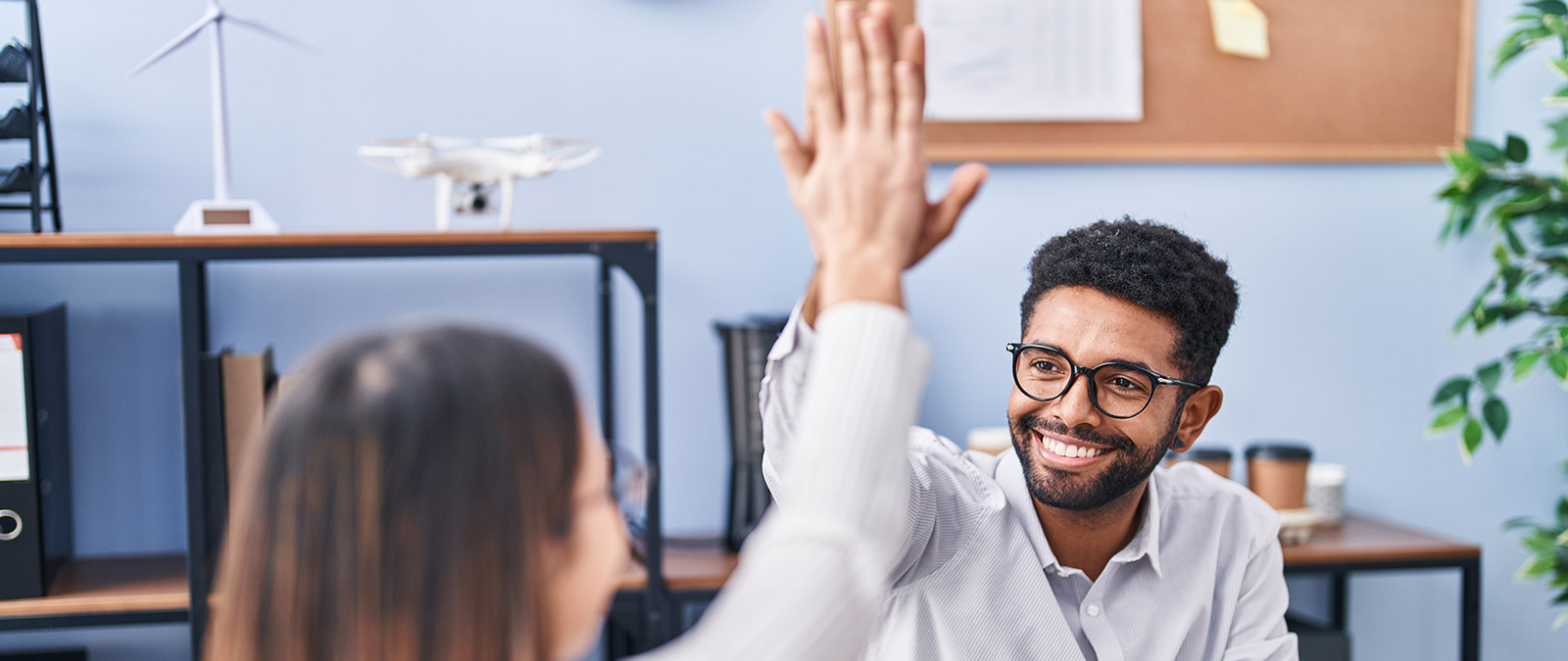 photo of two people high fiving